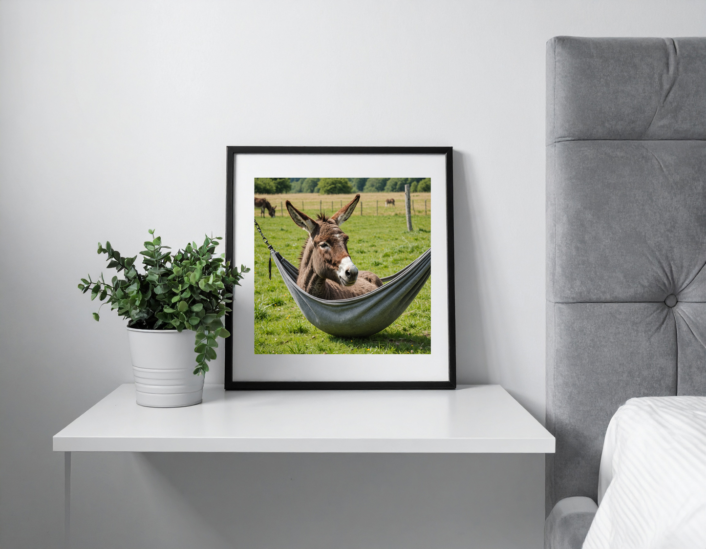 Donkey doing siesta in a hammok in a meadow with closed eyes